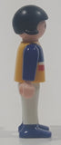 1995 Geobra Playmobil Small Black Haired Girl Child White Pants Blue Sweater with Yellow Red White Stripes 1/8" Tall Toy Figure