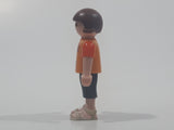 2010 Geobra Playmobil Small Brunette Girl Child Dark Grey Capri Pants Two Tone Orange Shirt with Lizard Design 2 1/8" Tall Toy Figure