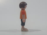 2010 Geobra Playmobil Small Brunette Girl Child Dark Grey Capri Pants Two Tone Orange Shirt with Lizard Design 2 1/8" Tall Toy Figure