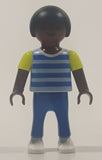 1995 Geobra Playmobil Small Black Haired Boy Child Blue Pants Two Tone Blue and Fluorescent Green Sleeved Shirt 2 1/8" Tall Toy Figure