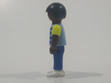 1995 Geobra Playmobil Small Black Haired Boy Child Blue Pants Two Tone Blue and Fluorescent Green Sleeved Shirt 2 1/8" Tall Toy Figure