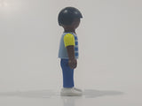 1995 Geobra Playmobil Small Black Haired Boy Child Blue Pants Two Tone Blue and Fluorescent Green Sleeved Shirt 2 1/8" Tall Toy Figure