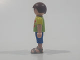 2010 Geobra Playmobil Small Brunette Boy Child Blue Capri Pants Two Tone Green Shirt Escula Red Skateboarder Design 2 1/8" Tall Toy Figure
