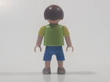 2010 Geobra Playmobil Small Brunette Boy Child Blue Capri Pants Two Tone Green Shirt Escula Red Skateboarder Design 2 1/8" Tall Toy Figure