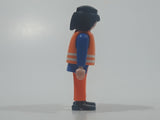 1990 Geobra Playmobil Black Hair Bright Orange Pants Blue Shirt Orange Vest 2 3/4" Tall Toy Figure