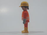 1992 Geobra Playmobil Brunette Hair Bright Orange Pants and Shirt Orange Jacket and Yellow Hard Hat Cap Construction Worker 2 3/4" Tall Toy Figure