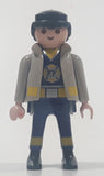 1997 Geobra Playmobil Black Hair Blue and Grey Firefighter 2 3/4" Tall Toy Figure