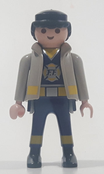 1997 Geobra Playmobil Black Hair Blue and Grey Firefighter 2 3/4" Tall Toy Figure