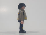 1997 Geobra Playmobil Black Hair Blue and Grey Firefighter 2 3/4" Tall Toy Figure