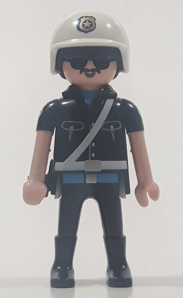 1992 Geobra Playmobil Black Hair Black Uniform White Helmet Police Officer 2 3/4" Tall Toy Figure
