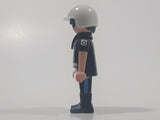 1992 Geobra Playmobil Black Hair Black Uniform White Helmet Police Officer 2 3/4" Tall Toy Figure
