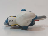 Vintage 1979 Peyo Smurfs Smurf Riding Bicycle 2 5/8" Long PVC Toy Figure