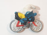 Vintage 1979 Peyo Smurfs Smurf Riding Bicycle 2 5/8" Long PVC Toy Figure