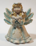 Angel Holding Song Book 4 3/4" Tall Resin Figurine