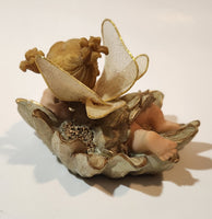 Angel Girl Child Lying on Flower 2 1/2" Tall Resin Figurine