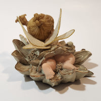 Angel Girl Child Lying on Flower 2 1/2" Tall Resin Figurine