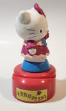 Hello Kitty 5 1/4" Tall Rotating Music Box Heavy Ceramic Resin Figure on Plastic Base