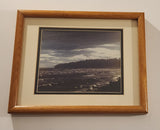 Waves Washing Ashore on a Beach with Two People in the Corner Black and White Purple Tinge Photograph in Frame