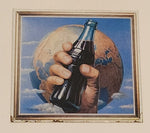 1993 The Coca Cola Company Earth Hand Holding A Bottle 13" x 13" Square Tin Metal Sign