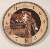FirsTime Chat Mechant "Naughty Cat" Laying On Top Of A Stack Of Books 11 1/2" Round Wall Clock with Paper Hands