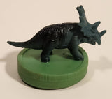 Green Styracosaurus Dinosaur Toy Figure on Green Base