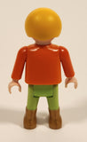 1992 Geobra Playmobil Blonde Haired Boy Green Pants Orange Top 2" Tall Toy Figure