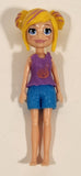 Mattel Polly Pocket Blonde Hair Purple Shirt with Orange Pumpkin and Blue Shorts 3 1/2" Tall Rubber Toy Doll Figure