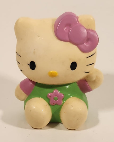 Sanrio Hello Kitty Sitting Pink Bow Green Overalls with Pink Flower 3" Rubber Toy Figure