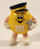 1990s M&Ms Yellow Character Pilot Holding Airplane 2 1/4" Tall Plastic Toy Figure