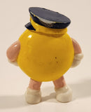 1990s M&Ms Yellow Character Pilot Holding Airplane 2 1/4" Tall Plastic Toy Figure