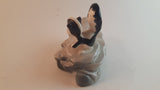 Vintage Porcelain Skunk on a Rock Figurine - Treasure Valley Antiques & Collectibles
