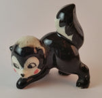 Vintage Porcelain Ceramic Playful Skunk Figurine - Treasure Valley Antiques & Collectibles