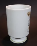 1973 Holly Hobbie Genuine Porcelain WWA "Love is the little things you do" Girls Smelling Flowers Pedestal Mug Cup - Treasure Valley Antiques & Collectibles