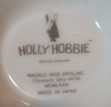 1973 Holly Hobbie Genuine Porcelain WWA "Love is the little things you do" Girls Smelling Flowers Pedestal Mug Cup - Treasure Valley Antiques & Collectibles