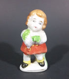 1945-1952 Occupied Japan Colonial Child Girl Holding Grapes in a Red Skirt White Top Black Shoes - Treasure Valley Antiques & Collectibles