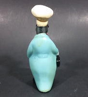 Vintage Black Duck in a Blue Suit Chef Cook Figurine Holding a Bottle of Bubbly - Treasure Valley Antiques & Collectibles