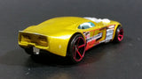 2007 Hot Wheels Nitro Door Slammer Aston Martin Metalflake Gold Die Cast Toy Race Car - Treasure Valley Antiques & Collectibles