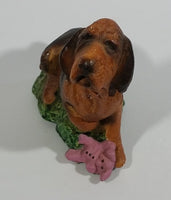Vintage 1981 Dark Brown Hound Dog Holding Down a Pink Teddy Bear on Grass Collectible Figurine Numbered #714