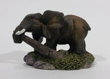 Elephant with Tusks Pulling a Log With It's Trunk Resin Figurine - SABRE - Treasure Valley Antiques & Collectibles