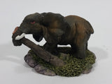 Elephant with Tusks Pulling a Log With It's Trunk Resin Figurine - SABRE - Treasure Valley Antiques & Collectibles