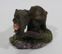 Elephant with Tusks Pulling a Log With It's Trunk Resin Figurine - SABRE - Treasure Valley Antiques & Collectibles