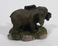 Elephant with Tusks Pulling a Log With It's Trunk Resin Figurine - SABRE - Treasure Valley Antiques & Collectibles