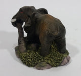 Elephant with Tusks Pulling a Log With It's Trunk Resin Figurine - SABRE - Treasure Valley Antiques & Collectibles
