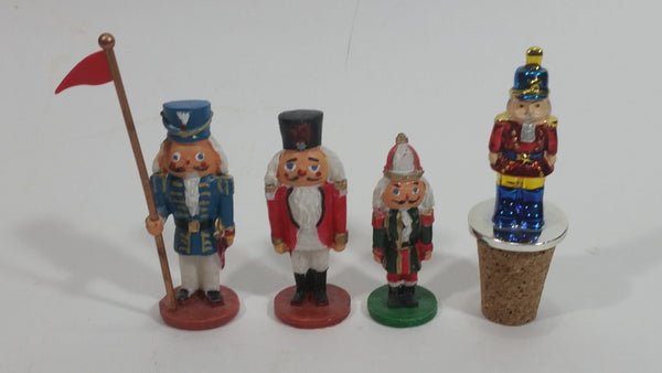 Three Small Christmas Nutcracker Figures and One Bottle Cork Nutcracker