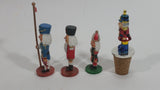Three Small Christmas Nutcracker Figures and One Bottle Cork Nutcracker