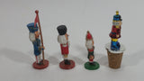 Three Small Christmas Nutcracker Figures and One Bottle Cork Nutcracker