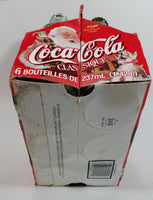 1999 Coca-Cola Classic Soda Pop Limited Edition Santa Claus 6-Pack of Empty 8 oz. Glass Bottles with Paper Carrier (4 Lids)