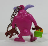 WBEI Warner Bros Looney Tunes Taz Wearing a Pink Easter Bunny Costume with Green Basket PVC Figurine Keychain Cartoon Collectible