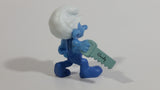2011 Peyo "Carpenter" Smurf Holding a Saw with a Pencil in His Ear PVC Toy Figure McDonald's Happy Meal