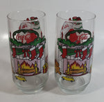1980s McCrory Stores Inc Set of 2 Coca-Cola Santa Claus Fireplace with Stockings and Toys Christmas Holiday Themed 6" Tall Glass Cup